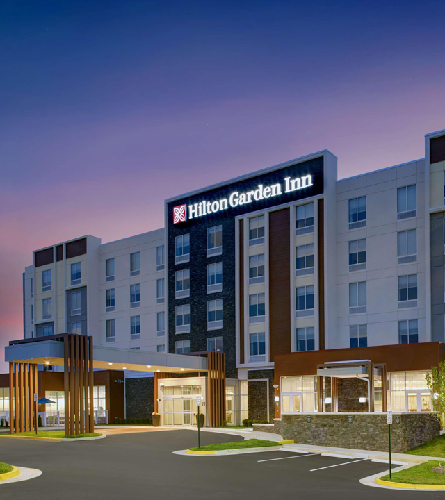 Landscaped garden and Hilton Garden Inn at Magnoliya Grand